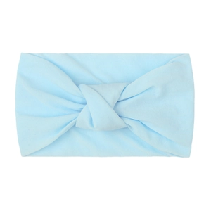 Detailed texture of baby blue ribbed knit fabric headband with soft double layer knot
