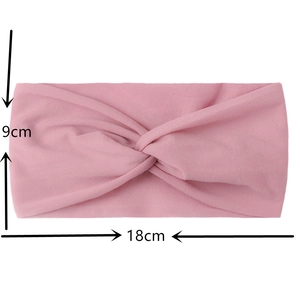 Pink nylon baby headband showing 18cm width and 9cm height measurements and texture