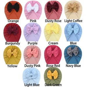 Set of 14 colorful newborn baby bow hats made of soft elastic waffle knit fabric