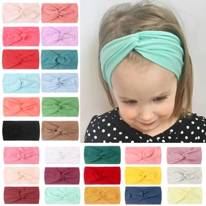 Close-up of baby nylon knotted headbands in 25 colors and elastic knit fabric