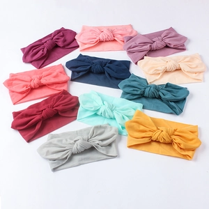 Set of 10 solid color nylon baby headbands with soft elastic bunny ears bow design