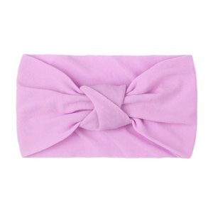 Detail of soft pink knotted nylon baby headband with wide double-layered fabric texture