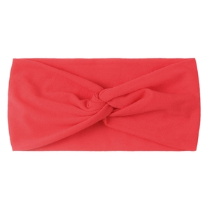 Detail of coral red knitted twist knot headband made of soft elastic fabric on white background