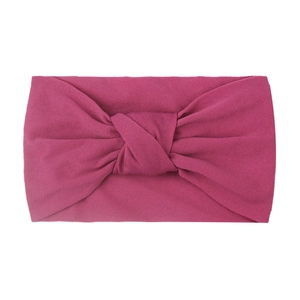 Detailed macro view of the rose red knotted wide nylon headband for baby girls