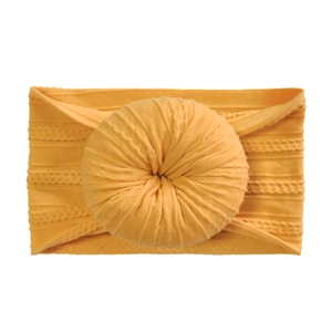 Mustard yellow stretchy nylon donut headbands for infants with soft jacquard texture