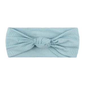 Close-up of light blue ribbed baby headband featuring a soft elastic hand-tied knot detail