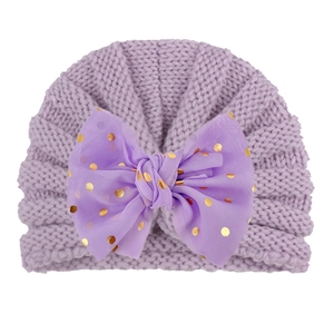 Purple baby knit hat with large mesh bow and gold sequins for winter warmth
