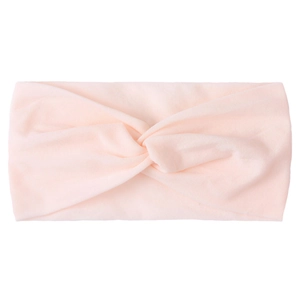 Detail of soft pale pink knotted nylon hair band with stylish cross knot design for girls