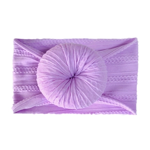 Soft purple cable knit baby headband featuring a stylish donut knot detail
