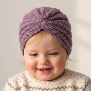 Detailed close-up of soft purple knit baby turban hat with wavy ribbed texture and warm fit