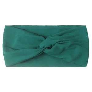 Detailed view of the dark forest green twisted knot design on the soft nylon hair band