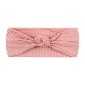 Detail shot of dusty pink ribbed elastic baby headband with a central knot design