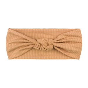 Elastic knotted ribbed headband for babies and toddlers in mustard yellow knit fabric