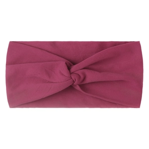 Detail of soft magenta knitted nylon headband with a stylish central knotted design