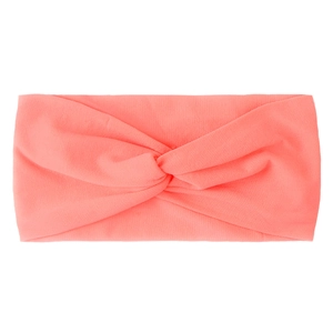 Detailed texture of coral pink knotted nylon hair band for babies and girls