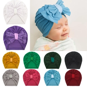 Bonnet turban bébé en maille douce avec grand nœud disponible en 10 couleurs variées
