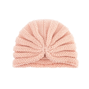 Soft pink knit turban hat for babies featuring a central knot design for warmth