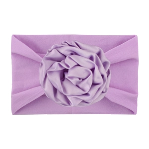 Comfortable purple nylon baby headband featuring a soft satin ribbon rosette flower