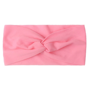 Detail of soft pink twisted nylon headband for babies with breathable ribbed knit fabric