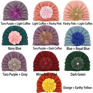 Cozy knit baby turban hats with large floral accents in diverse vibrant color options