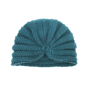 Close-up of baby turban hat in teal knit wool with ribbed texture and central knot detail
