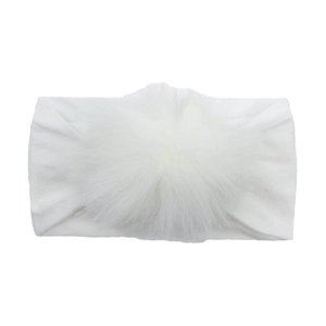 Close-up detail of soft white nylon baby headband with fluffy faux fur pom-pom ornament