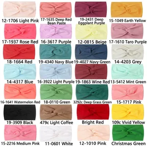 Set of 28 elastic nylon twisted headbands for babies in various vibrant solid colors