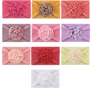 Soft nylon baby headbands with large fabric rose flowers in ten assorted vibrant colors