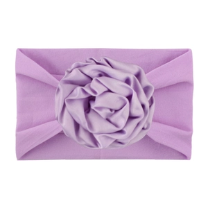 Soft nylon infant headband with a light purple satin layered rose for baby girls