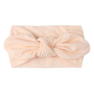 Diadema de nylon suave para bebé con lazo grande en color albaricoque para niña
