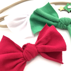 Détails des bandeaux de Noël pour bébé avec nœuds doux en rouge, vert et blanc éclatant