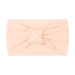 Soft apricot nylon knotted headband for babies with a flexible double-layered fabric design