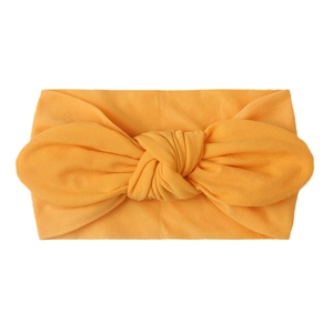 Diadema amarilla vibrante para bebé en nylon suave con lazo grande decorativo