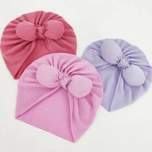 Three-piece infant bow beanie set in rose red, light pink, and lavender purple cotton