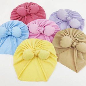 Soft baby bow turban hats set in six vibrant colors for infant winter warmth and style