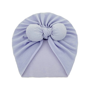 Detailed texture of lilac baby turban hat with a large decorative soft cotton bow