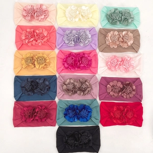 Set of 16 stretchy baby headbands with soft fabric flowers in various vibrant colors