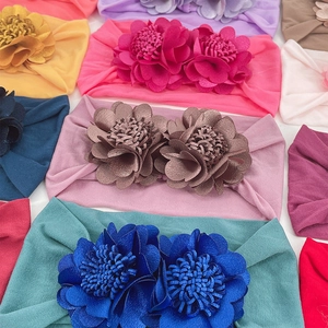 Elastic baby nylon headbands with large fabric flowers in multiple bright colors