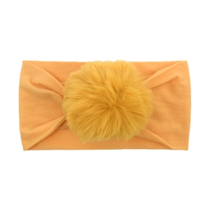 Fascia elastica in nylon per neonati con morbido pompon in colore giallo zenzero