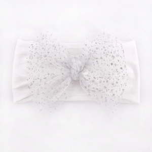 White nylon baby headband with a large sparkling glitter mesh bow for special occasions