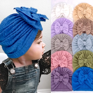 Detailed grid showing ten colorful waffle texture baby turban hats with large bows
