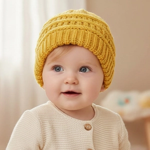 Close-up of bright yellow baby knitted beanie with soft ribbed cuff for autumn winter