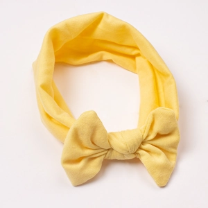 Elastic mustard yellow knit baby headband with a soft 3D classic bow for infants