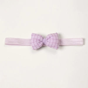 Detailed view of light purple gingham bow on a soft elastic baby headband accessory