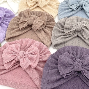 Knitted jacquard baby hats with large bows in various soft macaron colors