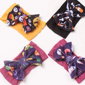 Set of 4 Halloween baby headbands featuring pumpkin and skull printed nylon bows