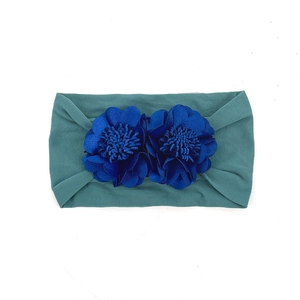 Green elastic baby headband featuring two dark blue 3D fabric flowers for girls