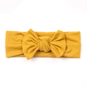 Fascia per neonati in cotone lavorato a maglia giallo con un grande fiocco centrale