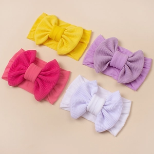 Set aus vier bonbonfarbenen Baby-Stirnbändern mit Schleifen aus Nylon-Waffelstrick