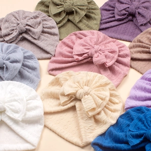 Baby bow knot beanie hats set in multiple colors with textured cable knit design